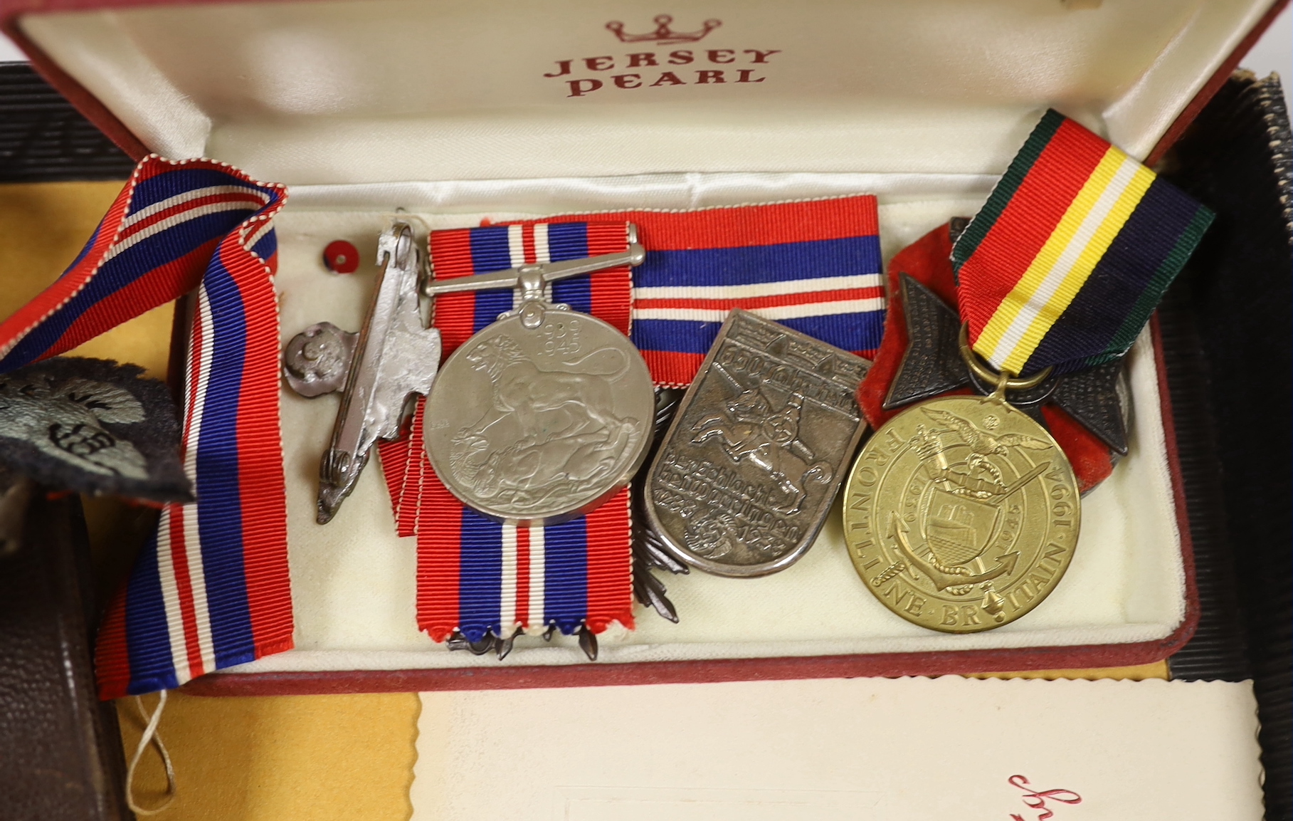 A WWI medal awarded to 990 PTE. F. GROCUTT. S. STAFF. R. together with other various medals, badges, paperwork, a bayonet etc.